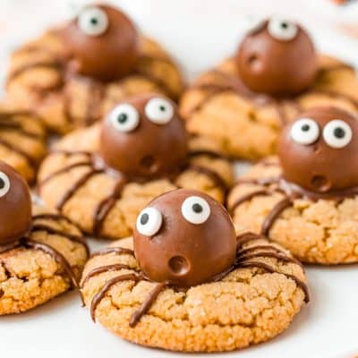 Halloween Spider cookies on a white plate.