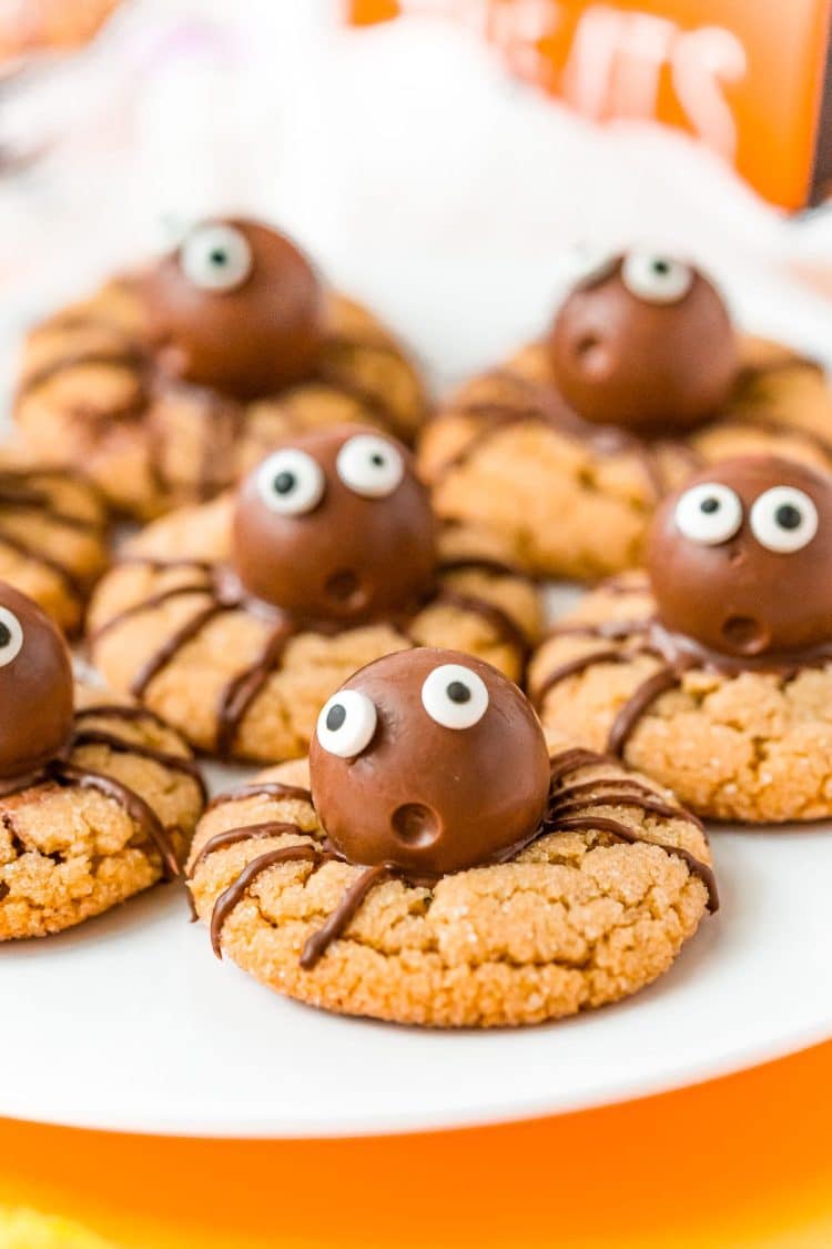 Halloween Spider cookies on a white plate.