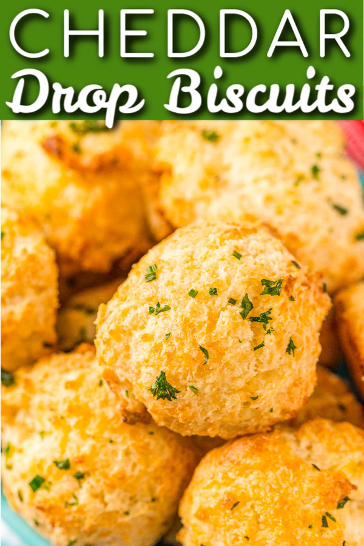 These Cheddar Drop Biscuits are loaded with Cheddar and Colby Jack Cheese and garlic flavor. They're a savory, buttery, and cheesy biscuit recipe everyone will love! via @sugarandsoulco