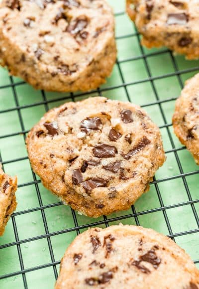 Salted chocolate chunk shortbread cookies on a wire rack.