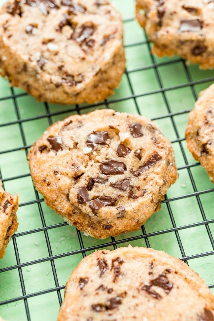 Salted chocolate chunk shortbread cookies on a wire rack.