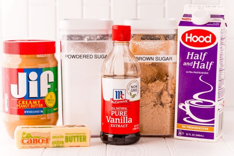 Ingredients to make peanut butter fudge on a white surface.