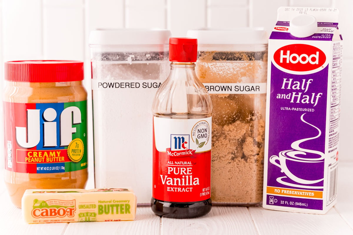 Ingredients to make peanut butter fudge on a white surface.