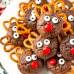 Reindeer Cookies stacked on top of each other on a white plate.