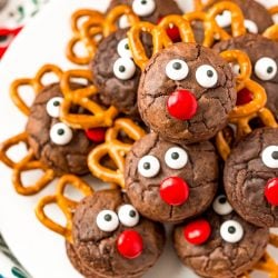 Reindeer Cookies stacked on top of each other on a white plate.