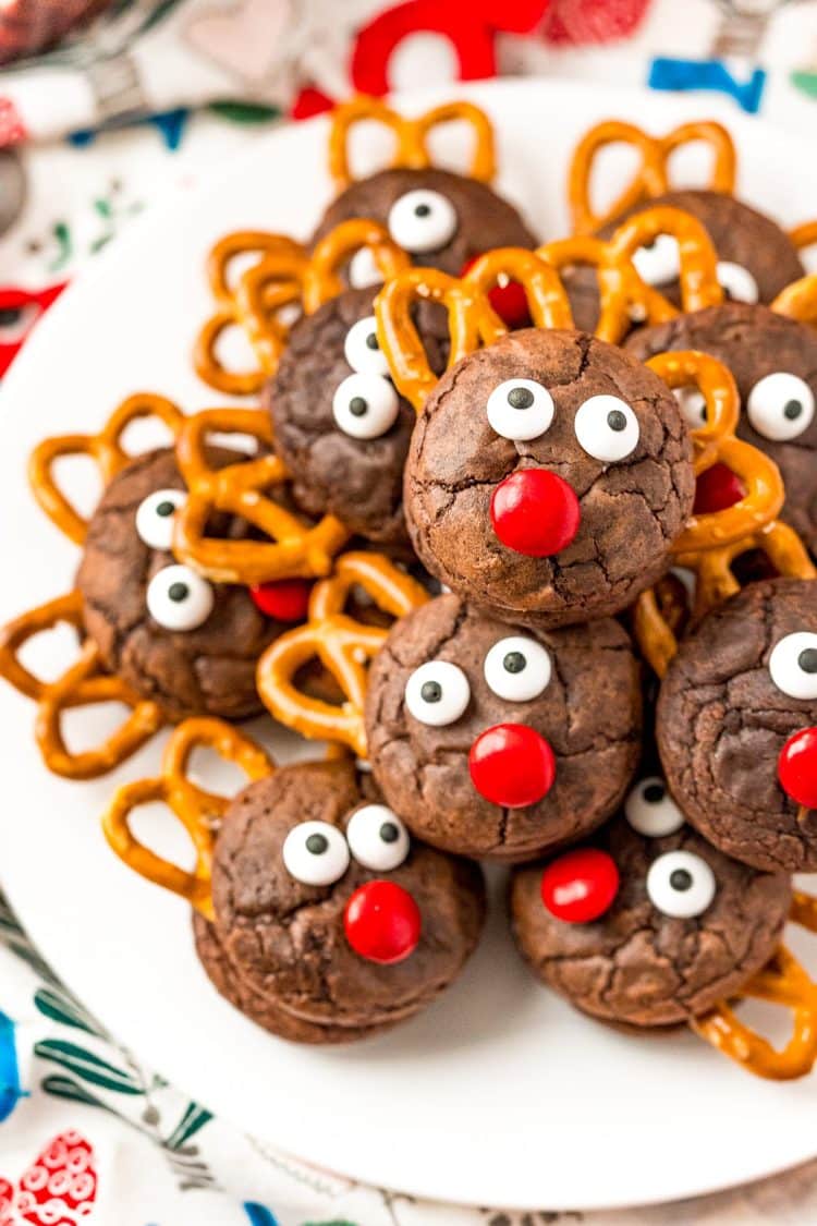 Reindeer Cookies stacked on top of each other on a white plate.