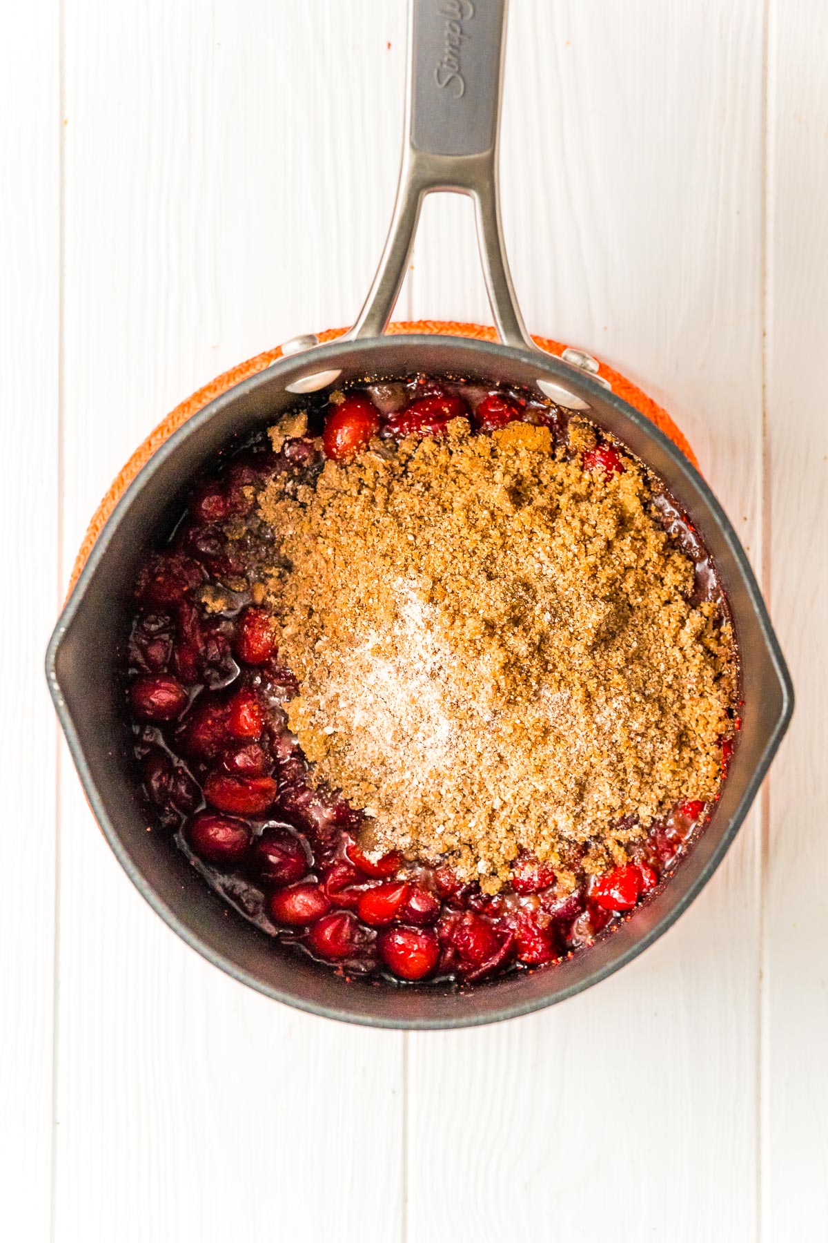 Cranberries and brown sugar and spices in a medium saucepan.