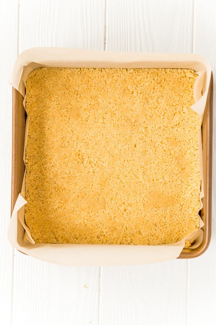 cookie crumbs in a square baking pan to make a crust.