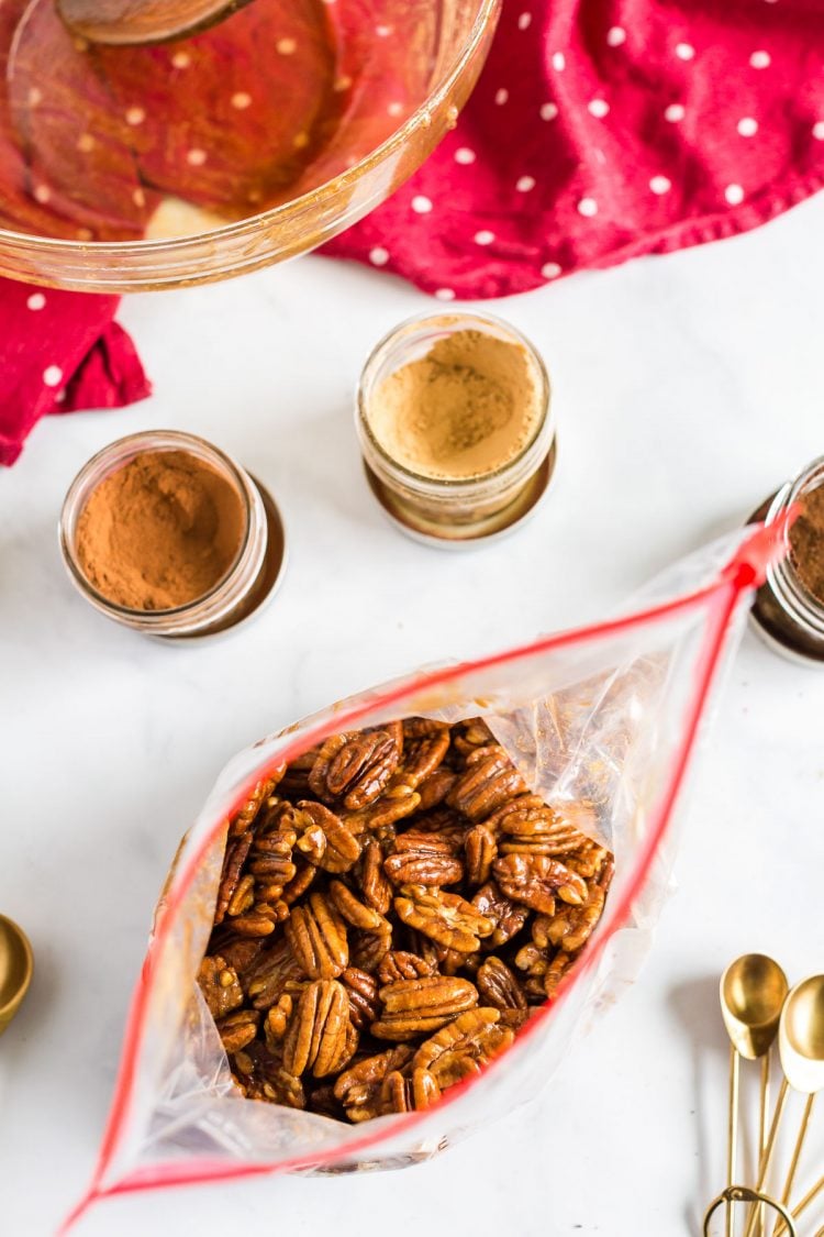 Pecans in a ziploc bag with sugar and spices.