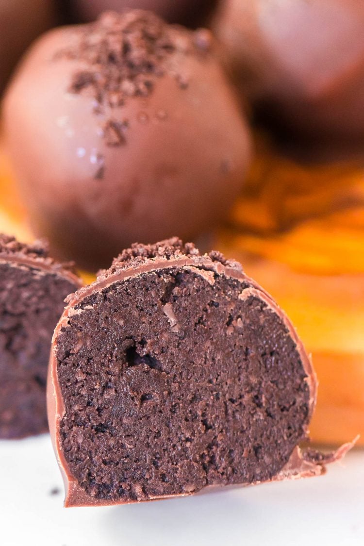Close up photo of a mint truffle that has been sliced in half.