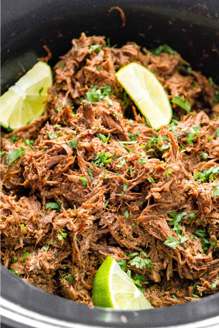 Barbacoa Beef Recipe is a delicious and easy slow cooker dish made with chipotle peppers, adobo sauce, brown sugar, garlic, cumin, cloves, and limes for a spicy crowd favorite! via @sugarandsoulco