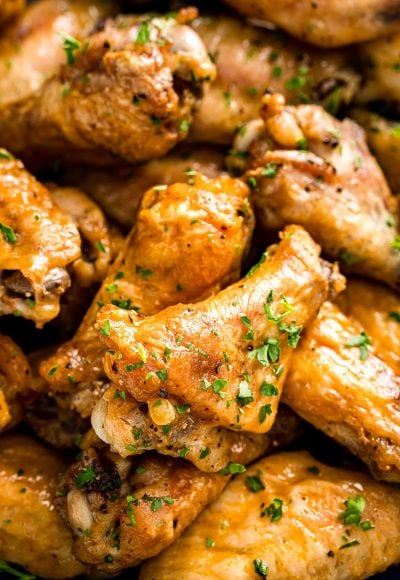 Chicken wings piled on top of each other in a bowl ready to eat.