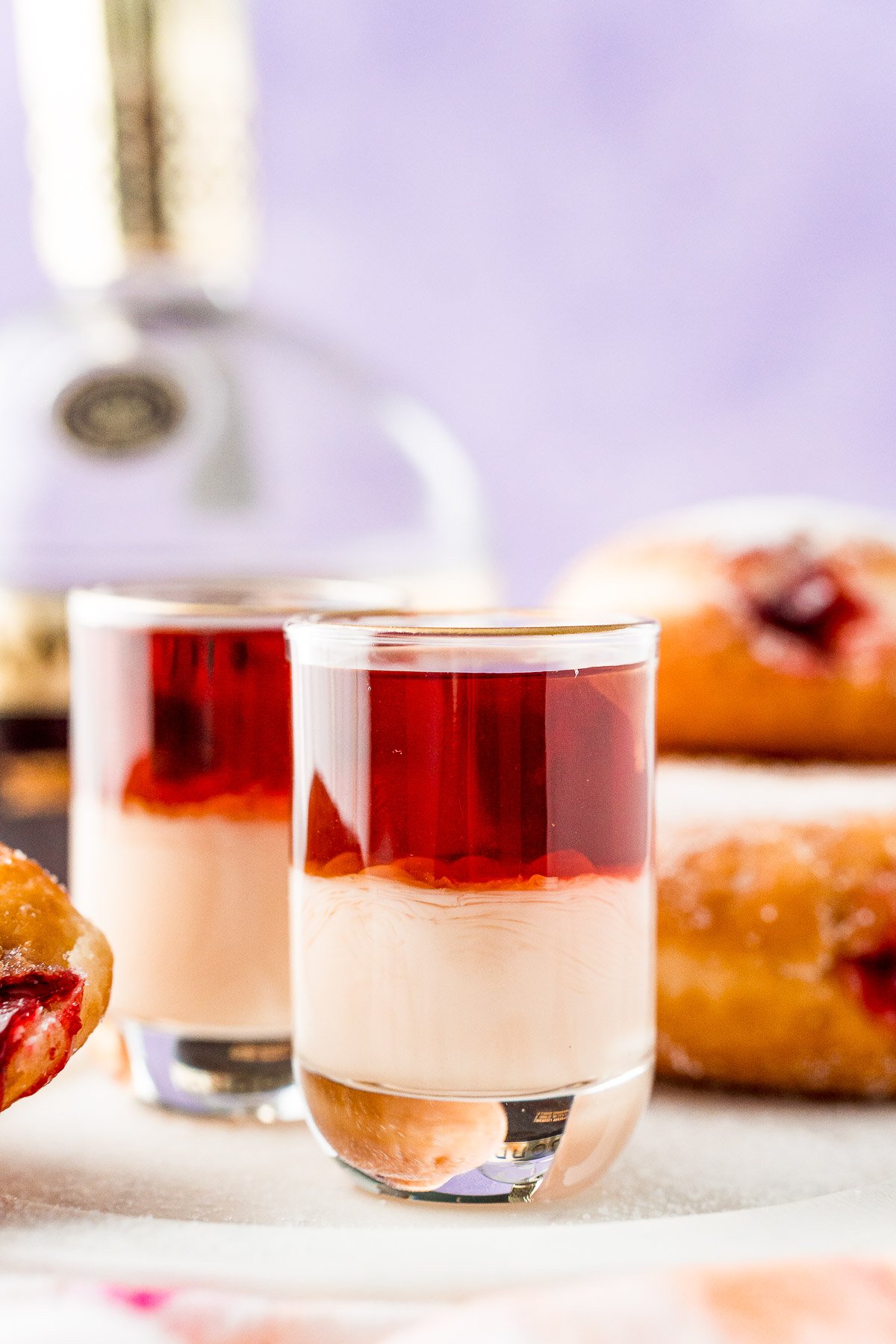 Close up photo of jelly donut shots.