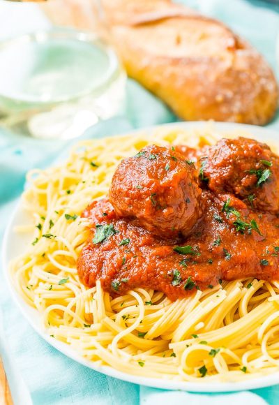 Meatballs on a plate of spaghetti.