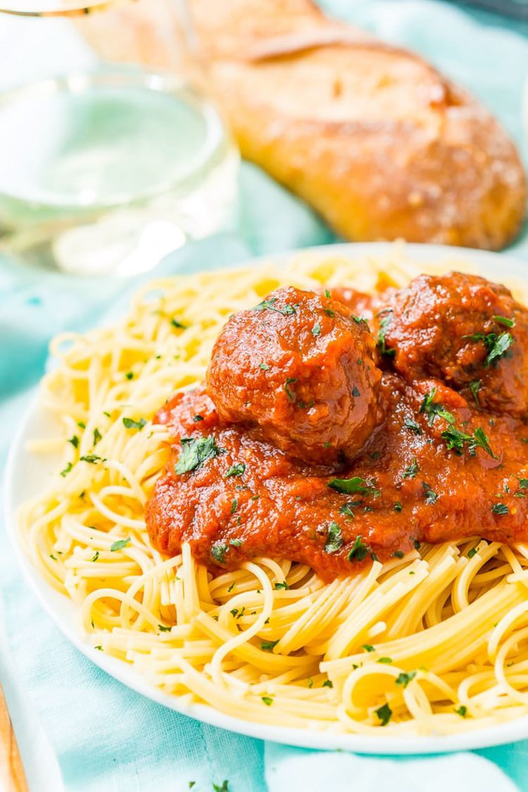 Meatballs on a plate of spaghetti.