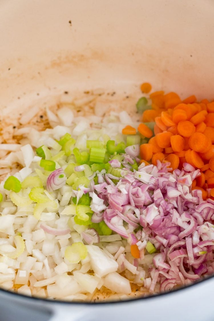 veggies being sauteed in a dutch oven.