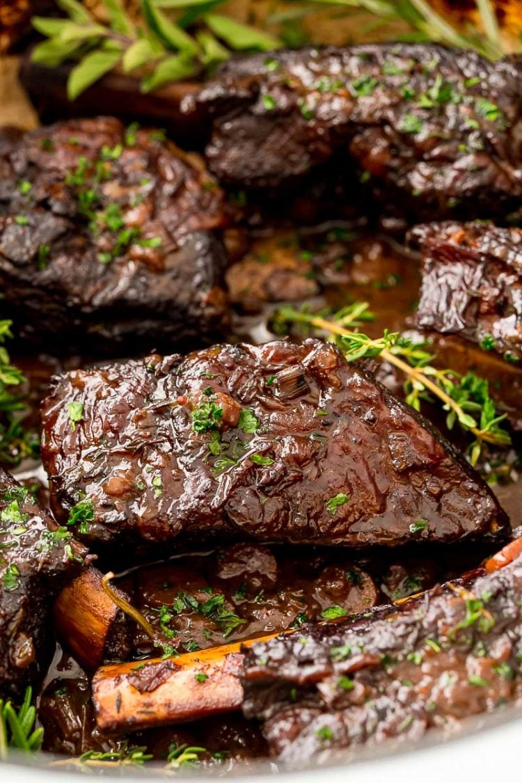 Beef short ribs in sauce in a dutch oven.