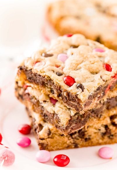 Close up photo of three chocolate chip cookie bars stacked on top of each other.