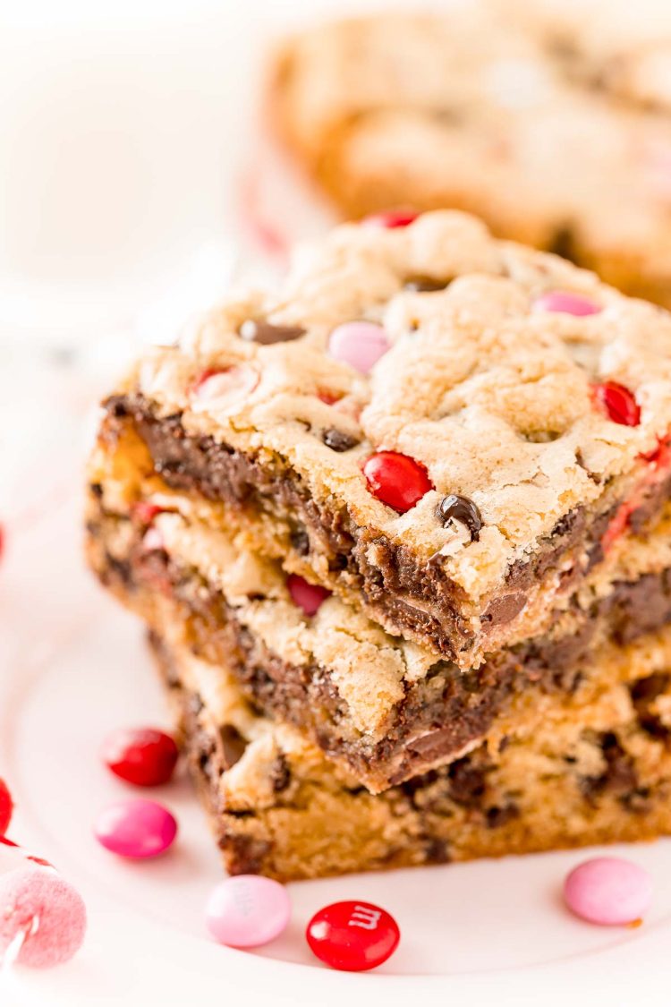 Close up photo of three chocolate chip cookie bars stacked on top of each other.