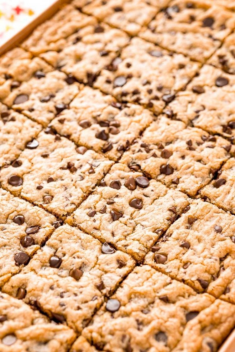 Chocolate Chip Cookies baked in a pan and sliced into squares.