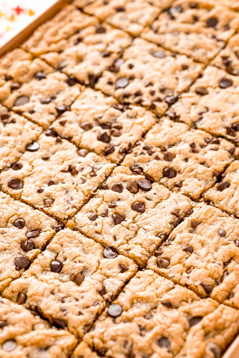 Chocolate Chip Cookies baked in a pan and sliced into squares.