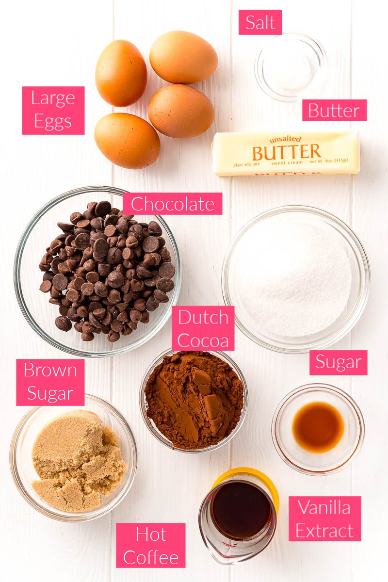 Overhead photo of the ingredients for flourless chocolate cake on a white table.