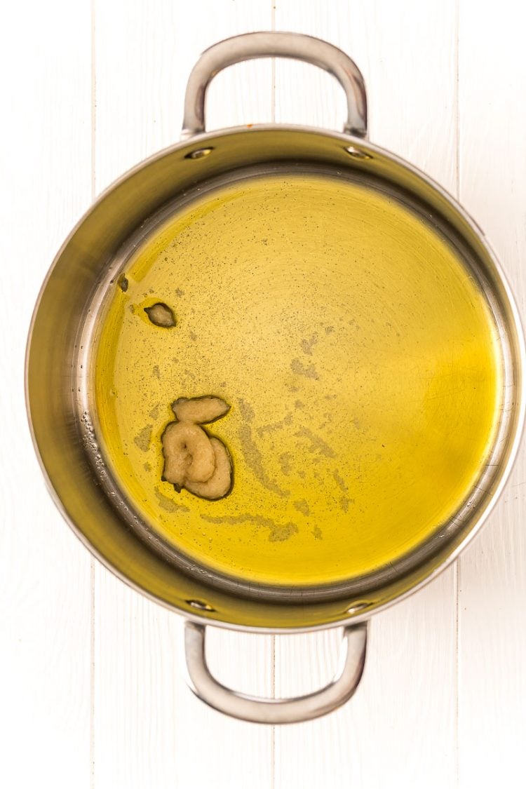 Olive oil and garlic in a large saucepan.