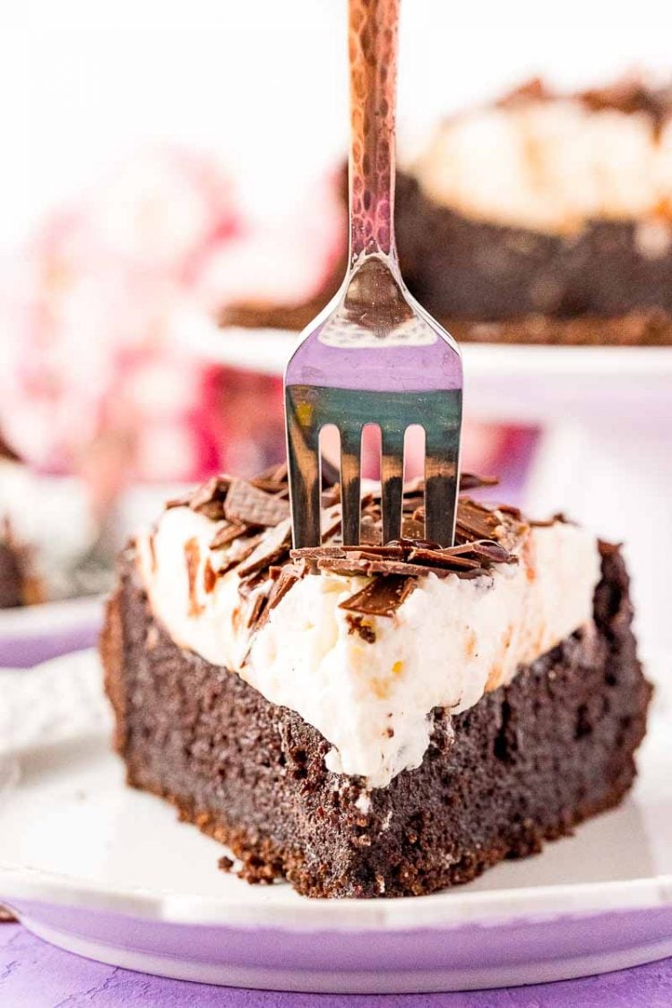 close up photo of a slice of Mississippi Mud Pie with a fork getting ready to take a bite out of it.
