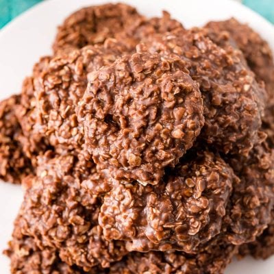 No bake cookies on a white plate on a blue napkin.