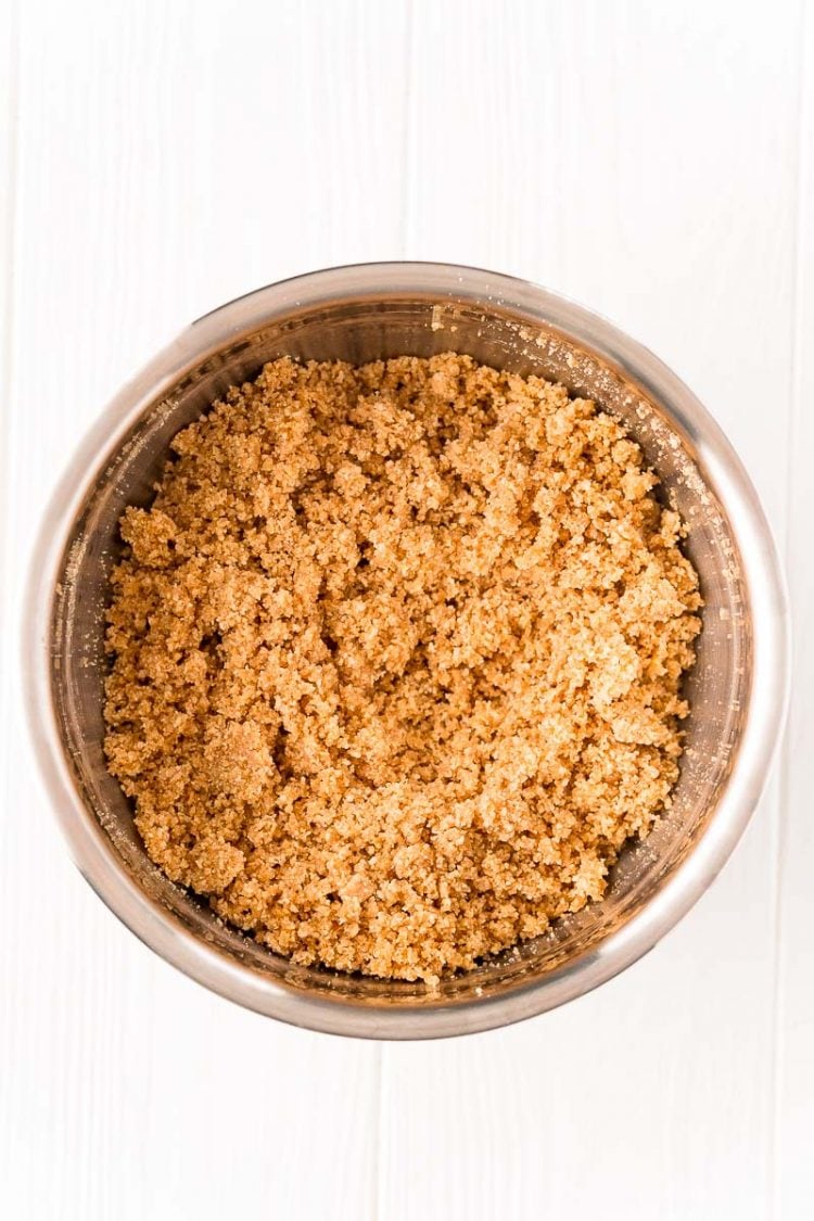 Graham cracker crumbs, butter, and sugar in a large mixing bowl.