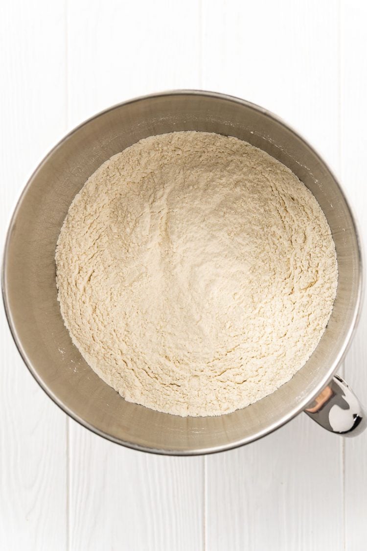 Dry ingredients to make bread in a stand mixer bowl.