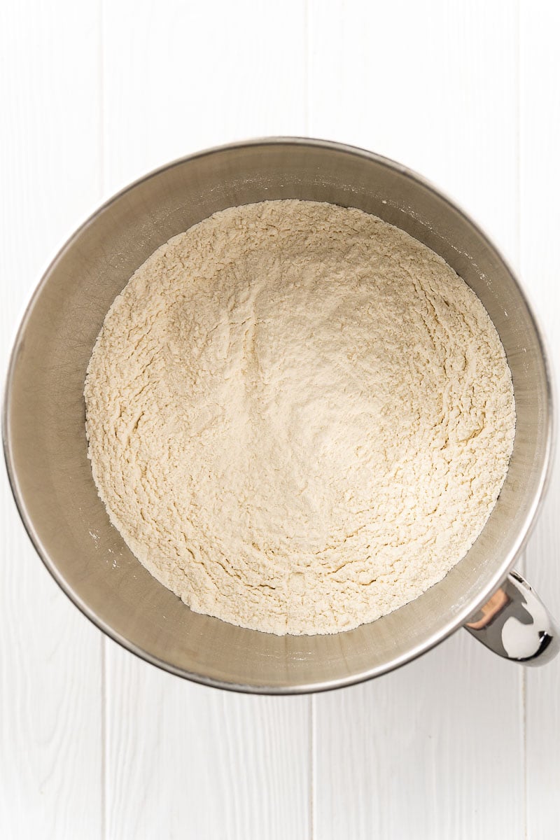 Dry ingredients to make bread in a stand mixer bowl.