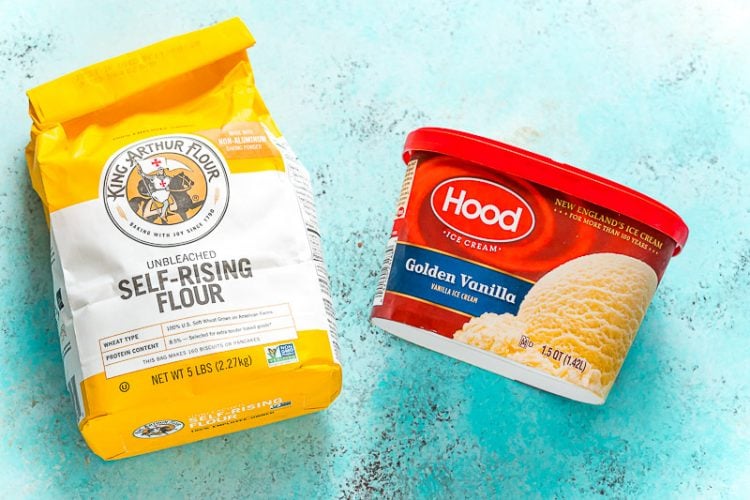package of self rising flour and vanilla ice cream on a blue surface.
