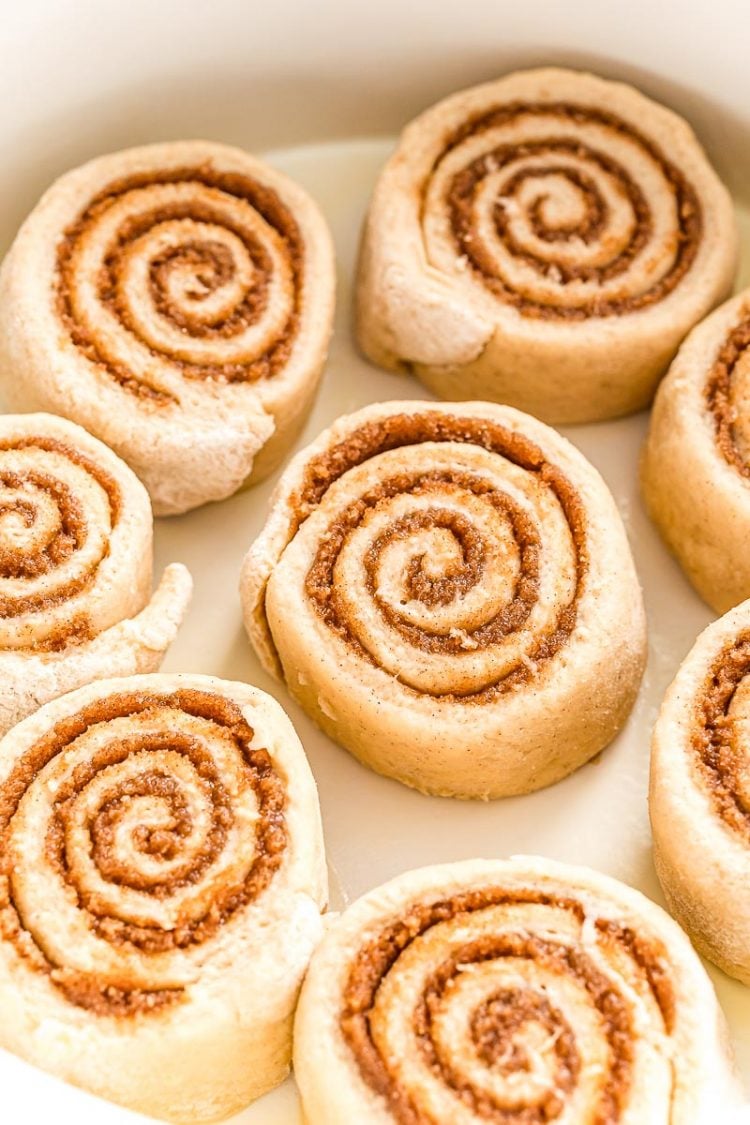 Cinnamon rolls in a casserole dish ready to bake.