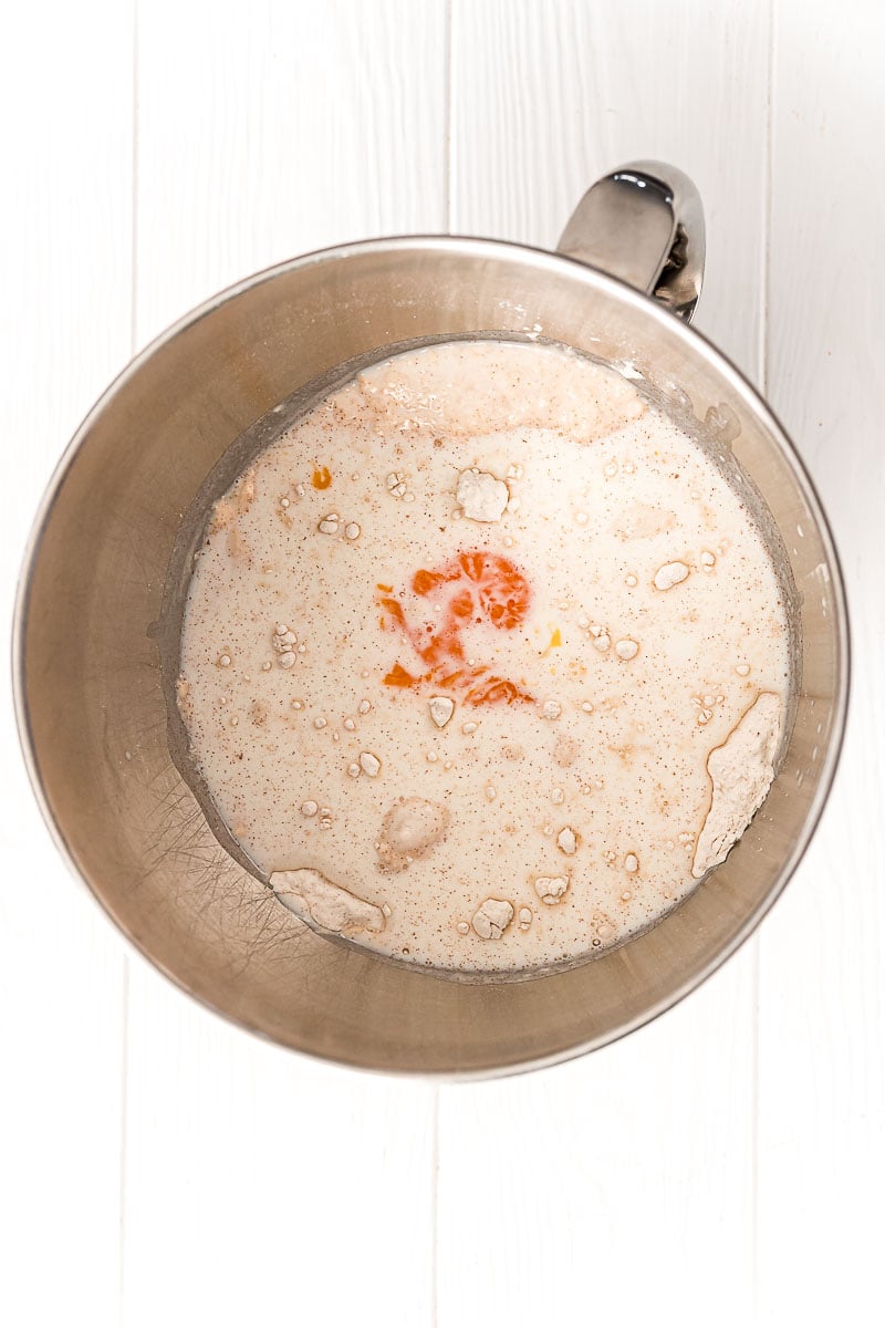 Ingredients to make cinnamon rolls in a mixing bowl.