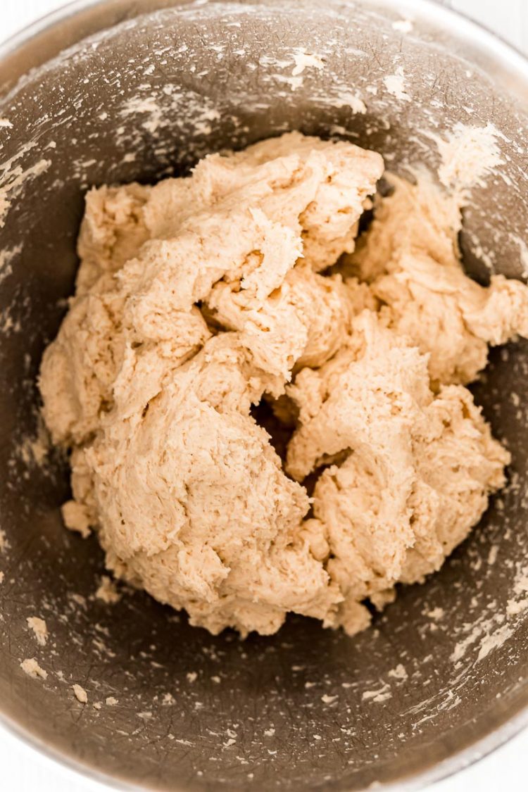 Dough for cinnamon rolls in a mixing bowl.