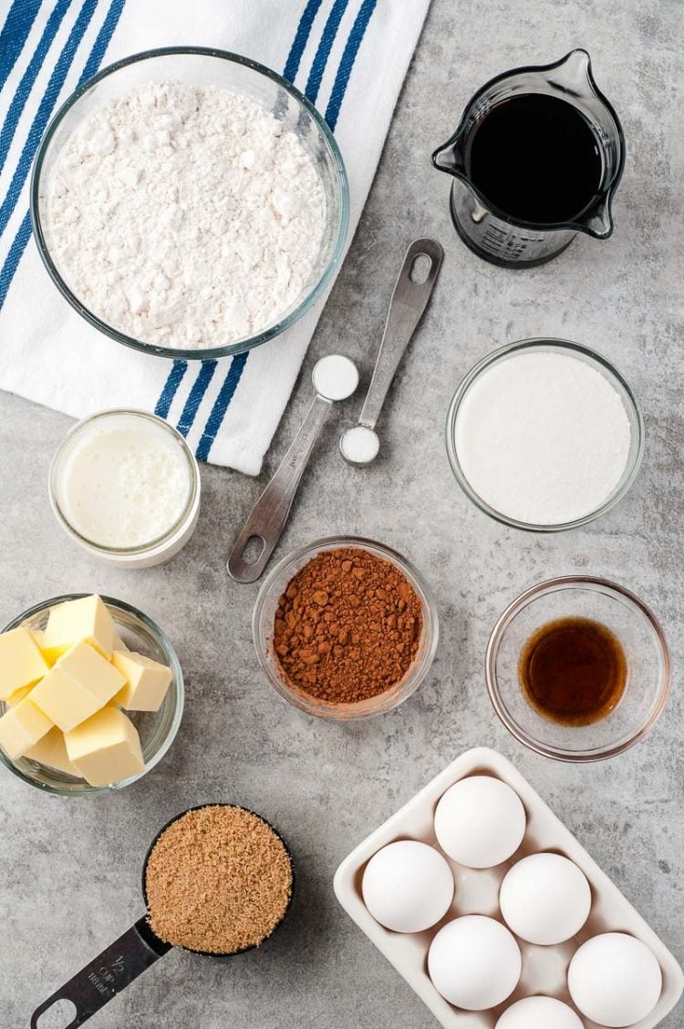 Overhead photo of ingredients to make Chocolate Buttermilk Cake on a grey table.