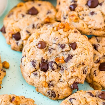 Chocolate chip walnut cookies piled on top of eachother.