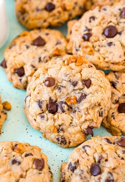 Chocolate chip walnut cookies piled on top of eachother.