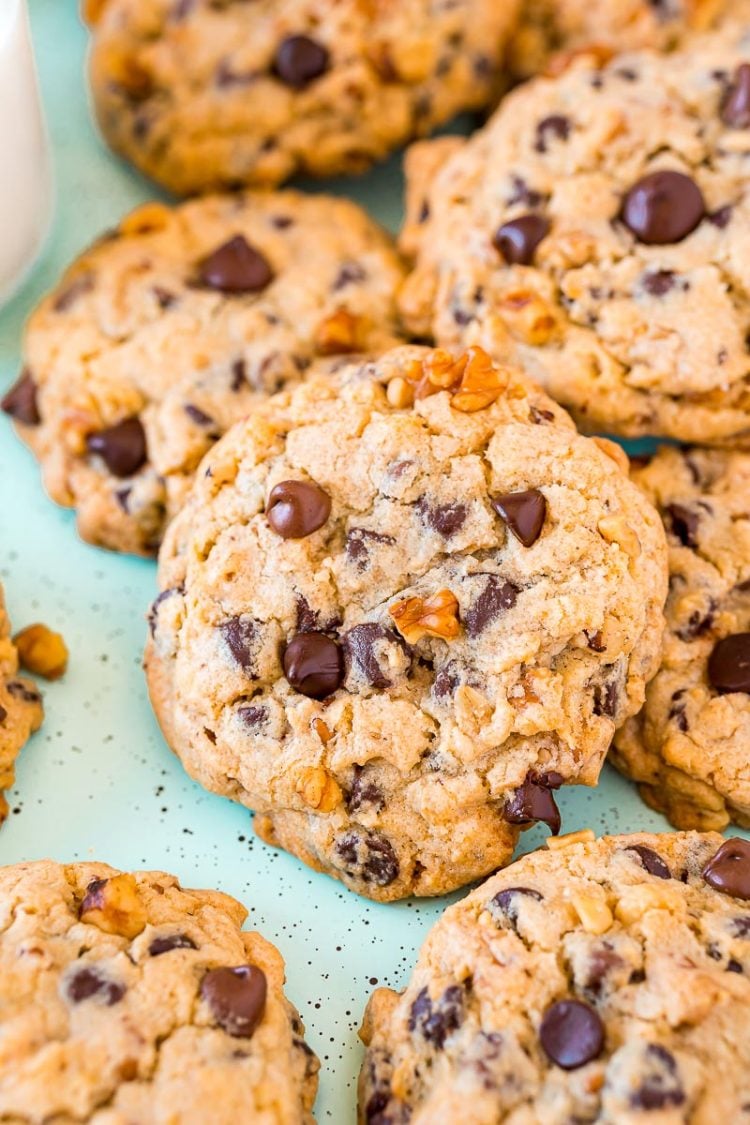 Chocolate chip walnut cookies piled on top of eachother.