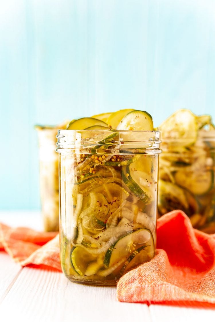 Bread and butter pickles in a pint mason jar.