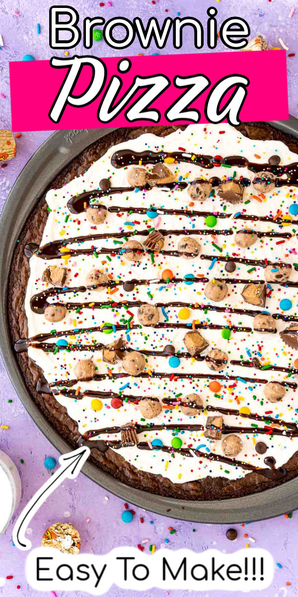 Brownie Dessert Pizza is a fun recipe everyone will enjoy! A “crust” of brownie is topped with a layer of Cream Cheese Whipped Cream, then finished with edible cookie dough, candy, and a drizzle of chocolate syrup! via @sugarandsoulco