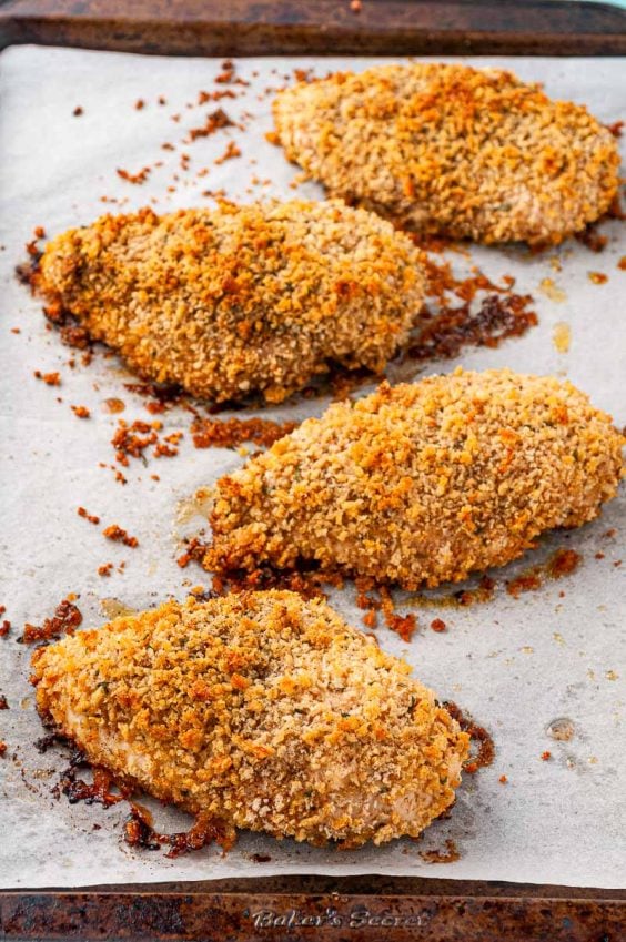 oven fried chicken on a baking sheet.