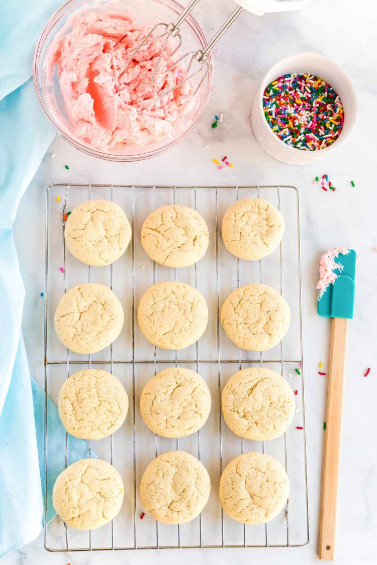 Soft sugar cookies on a cooling rack ready to be frosted.