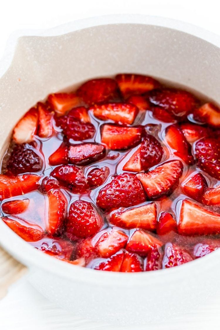 strawberries in a small pot to make simple syrup.