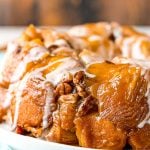 Close up photo of monkey bread on a white plate.