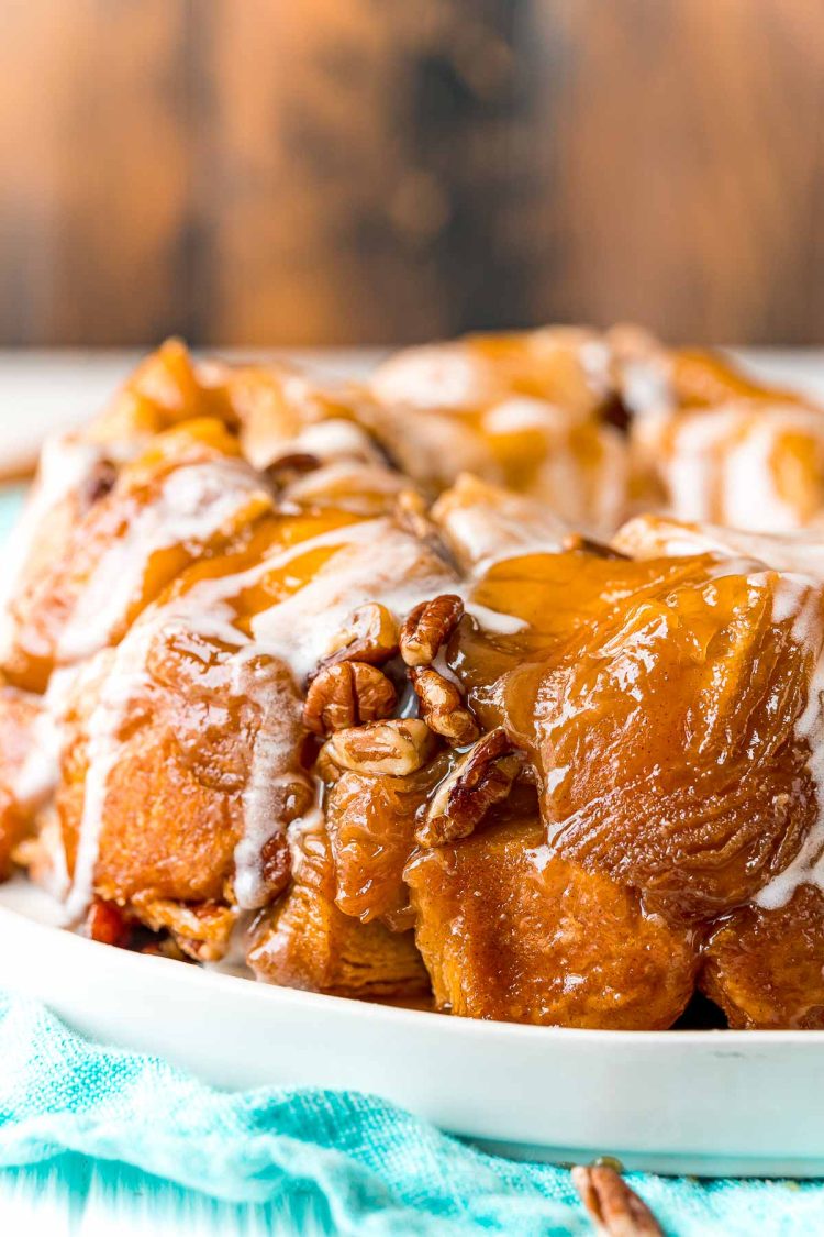 Close up photo of monkey bread on a white plate.