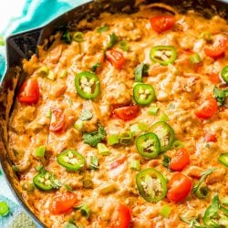 Cheesey sausage dip in a cast iron pan.