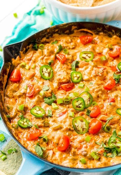 Cheesey sausage dip in a cast iron pan.