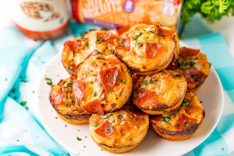 Mini pizzas on a white plate.